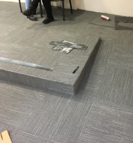 Carpet tiles being fitted