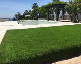 Grass laid next swimming pool