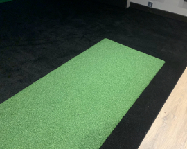 Black carpet with grass inset