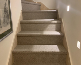 Staircase with cream sisal carpet